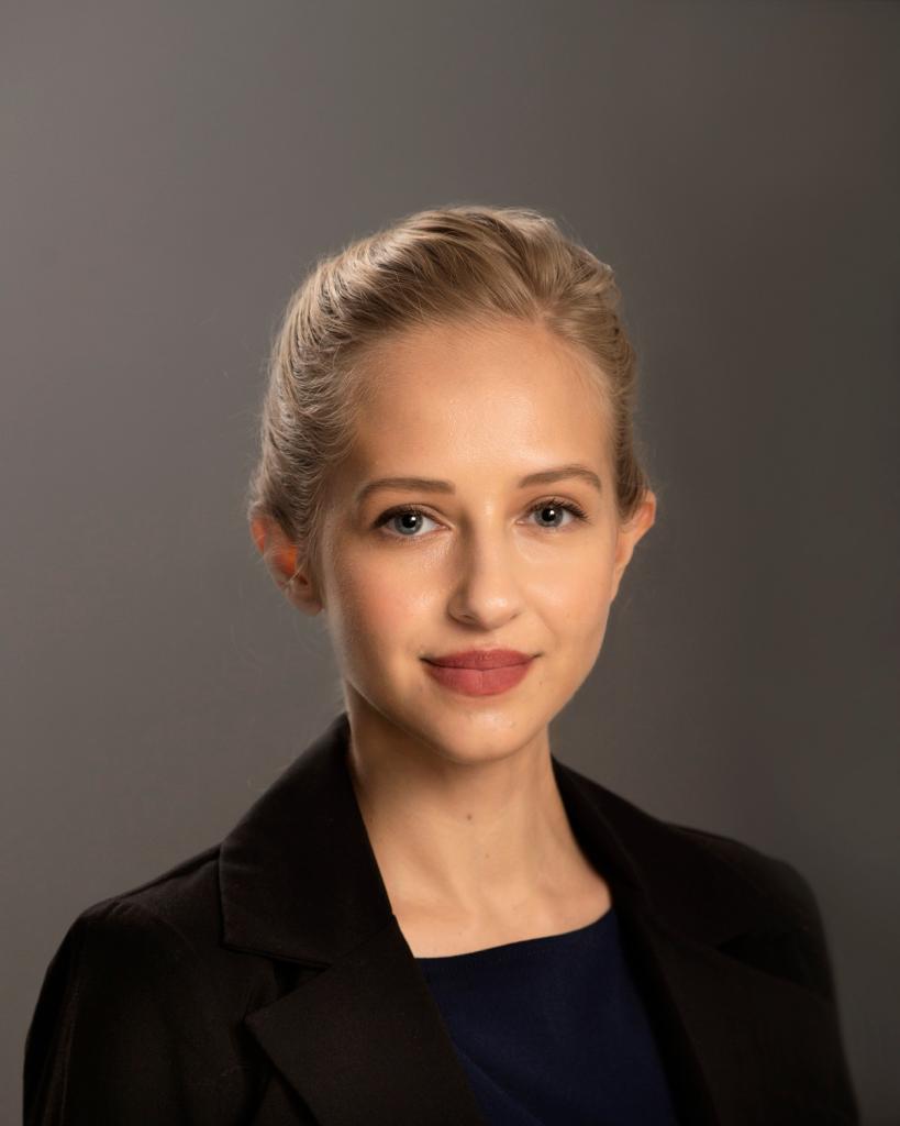 Headshot of Nadia Almasalkhi with gray background